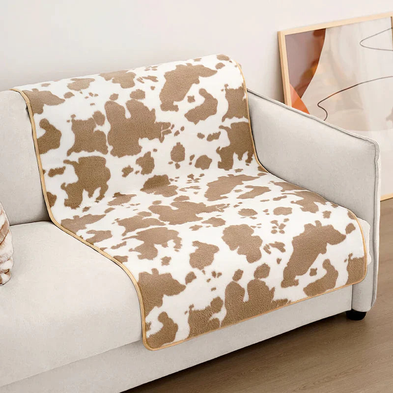 Stylische Haustierdecke im Kuhfell-Design